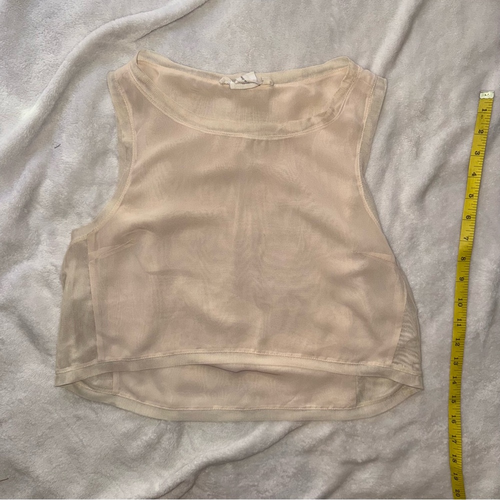 BCBGeneration Sheer Cream Crop Top with Light Fabric Wear.